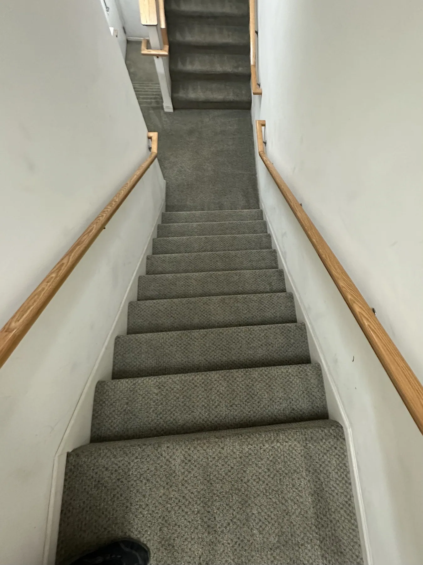 Staircase carpet after cleaning, seen from above looking down the stairwell