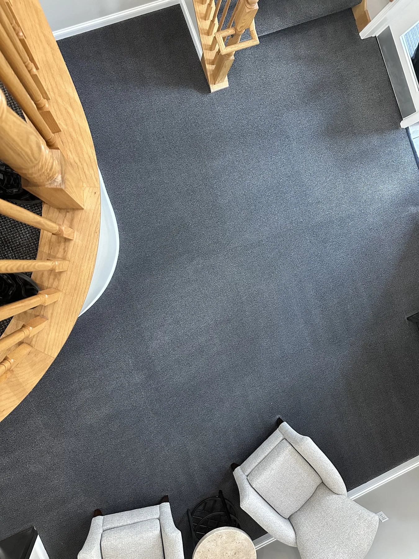 Same open room off the stairwell landing with clean, even carpet after cleaning